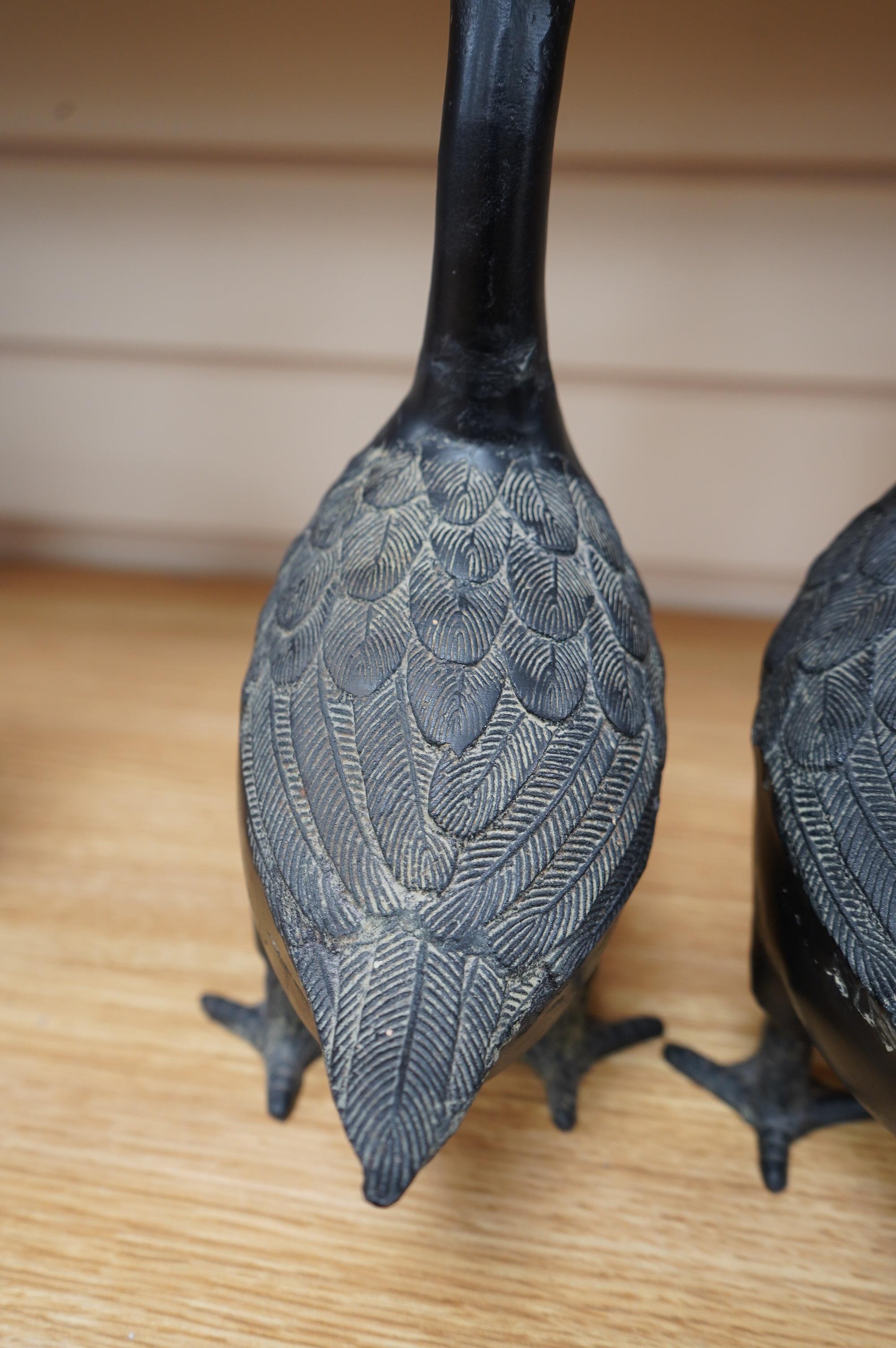 Two 20th century Japanese cast iron models of ducks, 28.5cm. Condition - fair to good